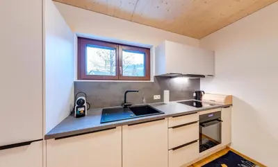 Küche/Küchenzeile in der Unterkunft Urban-Apartmenthaus zwischen Berg und See