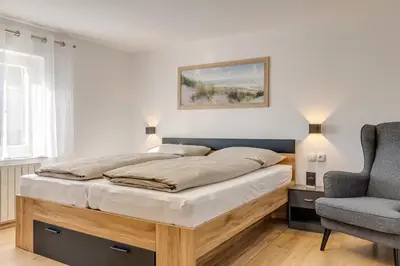 Ein Bett oder Betten in einem Zimmer der Unterkunft Seeperle Lochau - Der See ruft!