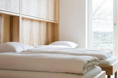 Ein Bett oder Betten in einem Zimmer der Unterkunft Bildungshaus Arbogast