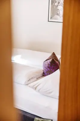 Ein Bett oder Betten in einem Zimmer der Unterkunft Gretina Appartements