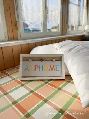 Ein Bett oder Betten in einem Zimmer der Unterkunft Ferienwohnung Alphome Rankweil