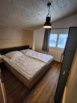 Ein Bett oder Betten in einem Zimmer der Unterkunft Alpenhaus Flügelbeck - Selbstversorgung