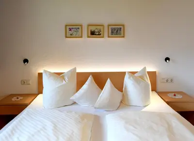 Ein Bett oder Betten in einem Zimmer der Unterkunft Ferienwohnung Lingg