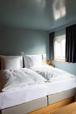 Ein Bett oder Betten in einem Zimmer der Unterkunft Forsthaus Waldesruh