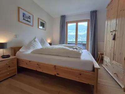 Ein Bett oder Betten in einem Zimmer der Unterkunft Ferienwohnung Enzian by Alpenfeder