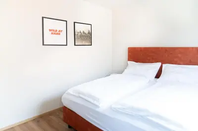 Ein Bett oder Betten in einem Zimmer der Unterkunft Velotique Hotel Angelika - Self-Check-in