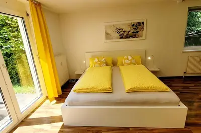 Ein Bett oder Betten in einem Zimmer der Unterkunft Top2 Apartmenthaus Sonnenschein