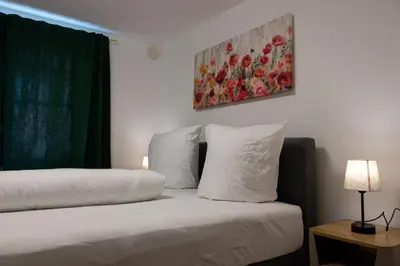 Ein Bett oder Betten in einem Zimmer der Unterkunft Retro-Style in der Bregenzer Fussgängerzone