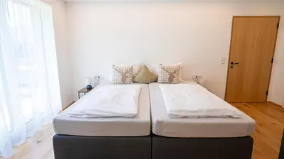 Ein Bett oder Betten in einem Zimmer der Unterkunft Ferienwohnung EMI