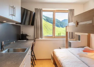 Ein Bett oder Betten in einem Zimmer der Unterkunft Appartements Basecamp Warth