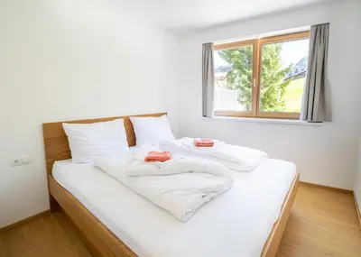 Ein Bett oder Betten in einem Zimmer der Unterkunft Appartements Basecamp Warth