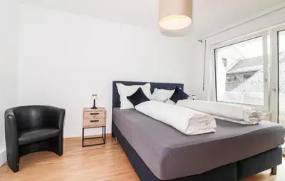 Ein Bett oder Betten in einem Zimmer der Unterkunft Ferienwohnung In Bludenz