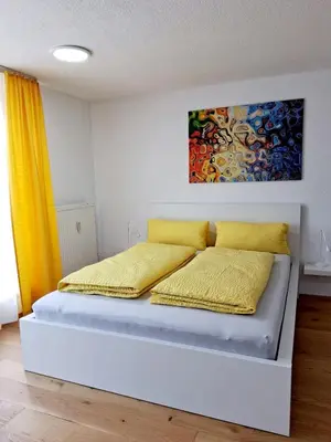 Ein Bett oder Betten in einem Zimmer der Unterkunft Top Glück Apartmenthaus Sonnenschein