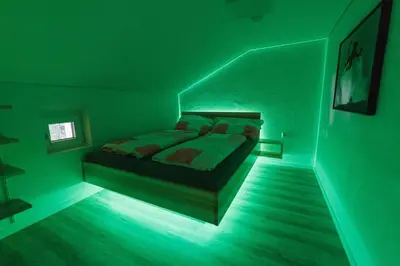 Ein Bett oder Betten in einem Zimmer der Unterkunft Ferienhaus Waldklause