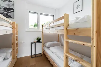Ein Bett oder Betten in einem Zimmer der Unterkunft homy City Diamant - Penthouse in Feldkirch, Grenznähe und doch Zentral