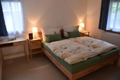 Ein Bett oder Betten in einem Zimmer der Unterkunft Gästehaus in Thüringen