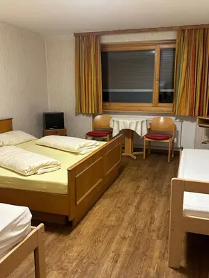Ein Bett oder Betten in einem Zimmer der Unterkunft Pension Tsingdao