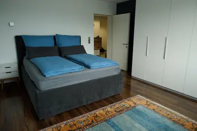 Ein Bett oder Betten in einem Zimmer der Unterkunft Ferienwohnung in Dormbirn