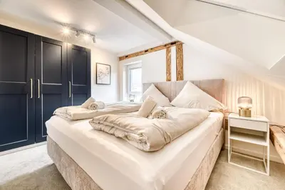Ein Bett oder Betten in einem Zimmer der Unterkunft Ferienwohnung Alpen Zentral