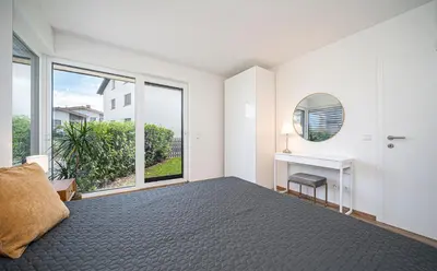 Ein Bett oder Betten in einem Zimmer der Unterkunft Moderner Bungalow in Seenähe
