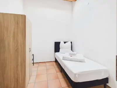 Ein Bett oder Betten in einem Zimmer der Unterkunft CROWN LIVING Babylon Studios Lustenau - Studios nahe Messe und Schweizer Grenze, WLAN, kostenloser Parkplatz, Self Check-in, ideal für Geschäftsreisende und Feriengäste
