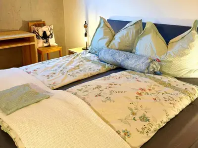Ein Bett oder Betten in einem Zimmer der Unterkunft Dog-friendly holiday apartment in Bregenzerwald