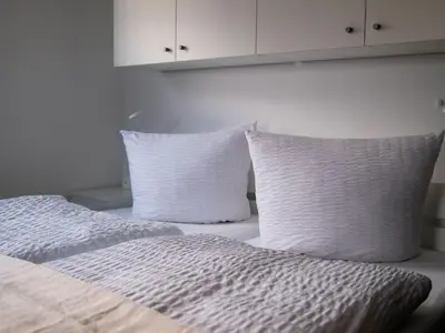 Ein Bett oder Betten in einem Zimmer der Unterkunft Haus Gallys