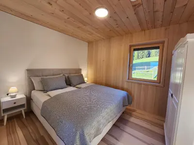 Ein Bett oder Betten in einem Zimmer der Unterkunft Blickfang Bregenzerwald