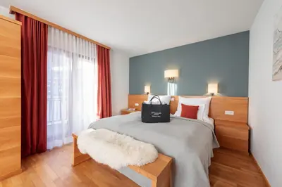 Ein Bett oder Betten in einem Zimmer der Unterkunft Boutique Hotel Murmeli - Ski in & Ski out
