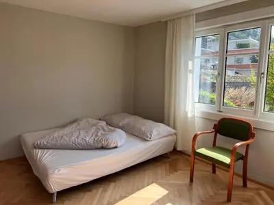 Ein Bett oder Betten in einem Zimmer der Unterkunft Sunset View Apartment Bregenz Bodensee