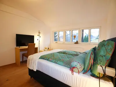 Ein Bett oder Betten in einem Zimmer der Unterkunft Holiday apartment in Bregenzerwald