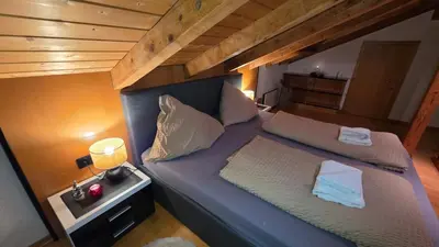 Ein Bett oder Betten in einem Zimmer der Unterkunft Apartment Alex Ski Parkplatz Winterurlaub