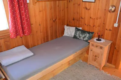 Ein Bett oder Betten in einem Zimmer der Unterkunft Ferienhaus Fritzensee