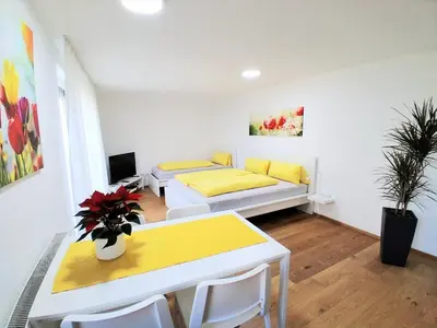Ein Bett oder Betten in einem Zimmer der Unterkunft Top18 Apartmenthaus Sonnenschein