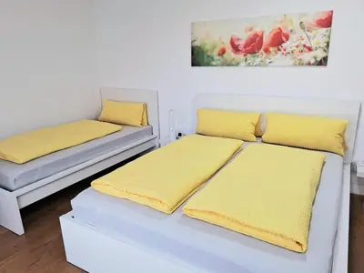 Ein Bett oder Betten in einem Zimmer der Unterkunft Top18 Apartmenthaus Sonnenschein