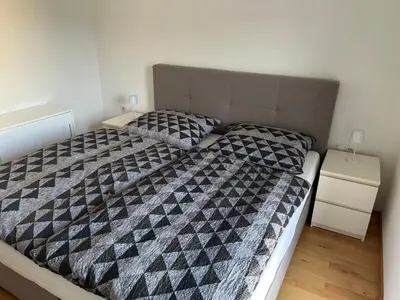 Ein Bett oder Betten in einem Zimmer der Unterkunft Helle, gemütliche 2-Zimmerwohnung in Feldkirch
