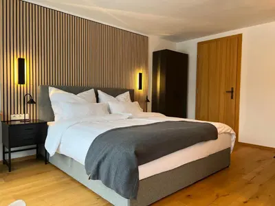 Ein Bett oder Betten in einem Zimmer der Unterkunft Alpencabin Montafon
