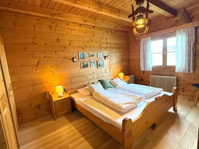 Ein Bett oder Betten in einem Zimmer der Unterkunft Ferienwohnungen im Blockhaus Metzler