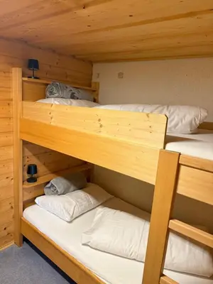 Ein Bett oder Betten in einem Zimmer der Unterkunft Ferienwohnungen im Blockhaus Metzler