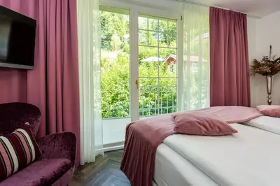 Ein Bett oder Betten in einem Zimmer der Unterkunft Boutiquehotel Bergvilla Am Fuße der Alpen