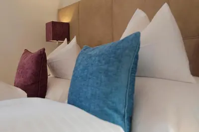Ein Bett oder Betten in einem Zimmer der Unterkunft Hotel Burgwald - Ski In & Ski Out