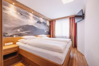 Ein Bett oder Betten in einem Zimmer der Unterkunft Hotel Garni Lavendel
