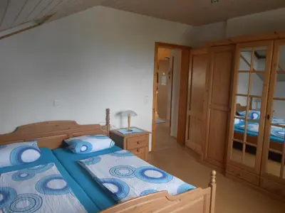 Ein Bett oder Betten in einem Zimmer der Unterkunft Ferienwohnung Jutta