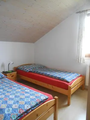 Ein Bett oder Betten in einem Zimmer der Unterkunft Ferienwohnung Jutta
