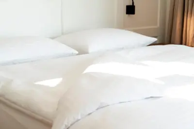 Ein Bett oder Betten in einem Zimmer der Unterkunft Hotel Zum Verwalter Dornbirn