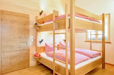 Ein Bett oder Betten in einem Zimmer der Unterkunft Gastler Chalet