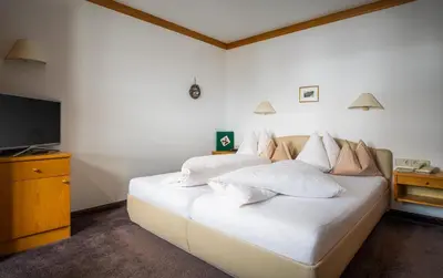 Ein Bett oder Betten in einem Zimmer der Unterkunft Pension Juliana