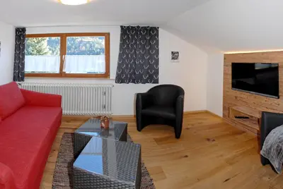 Ein Sitzbereich in der Unterkunft Der Berghof