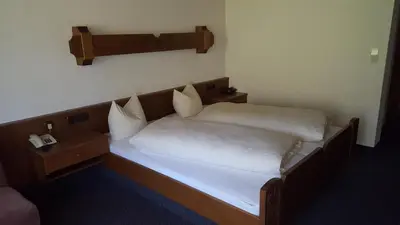 Ein Bett oder Betten in einem Zimmer der Unterkunft Hotel Garni