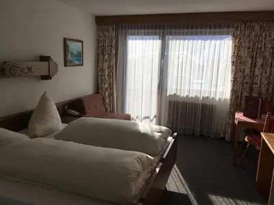 Ein Bett oder Betten in einem Zimmer der Unterkunft Hotel Garni